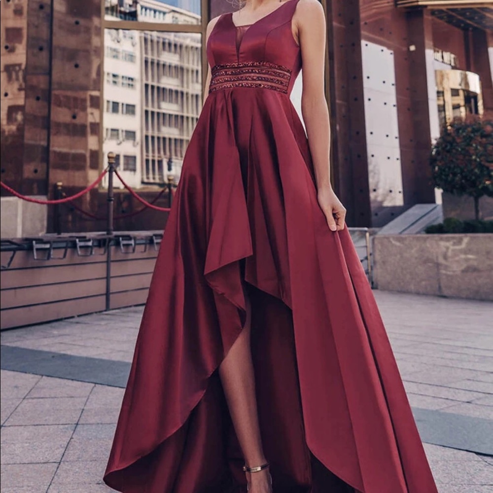 Hi low burgundy dress. New. Never Worn but I did cut the tags off.